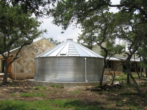 corrugated metal cistern with peaked roof